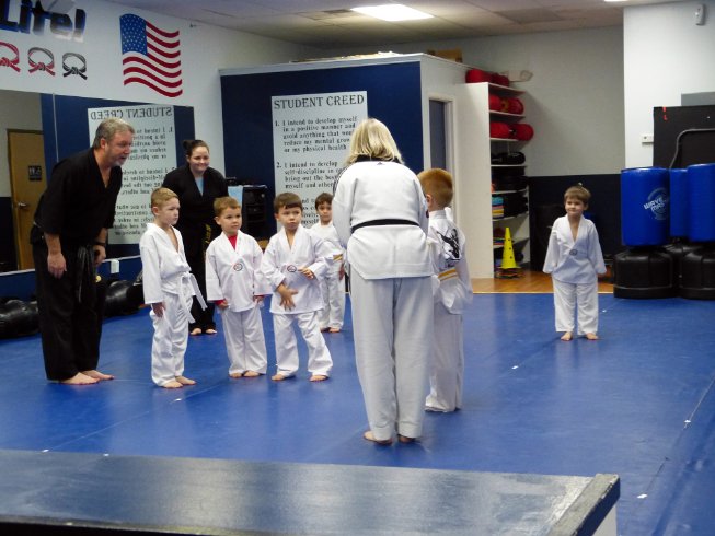 Class bowing to new yellow belt